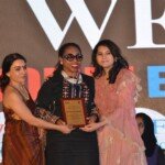 Kemi Sogunle receiving the ICONIC Woman Award